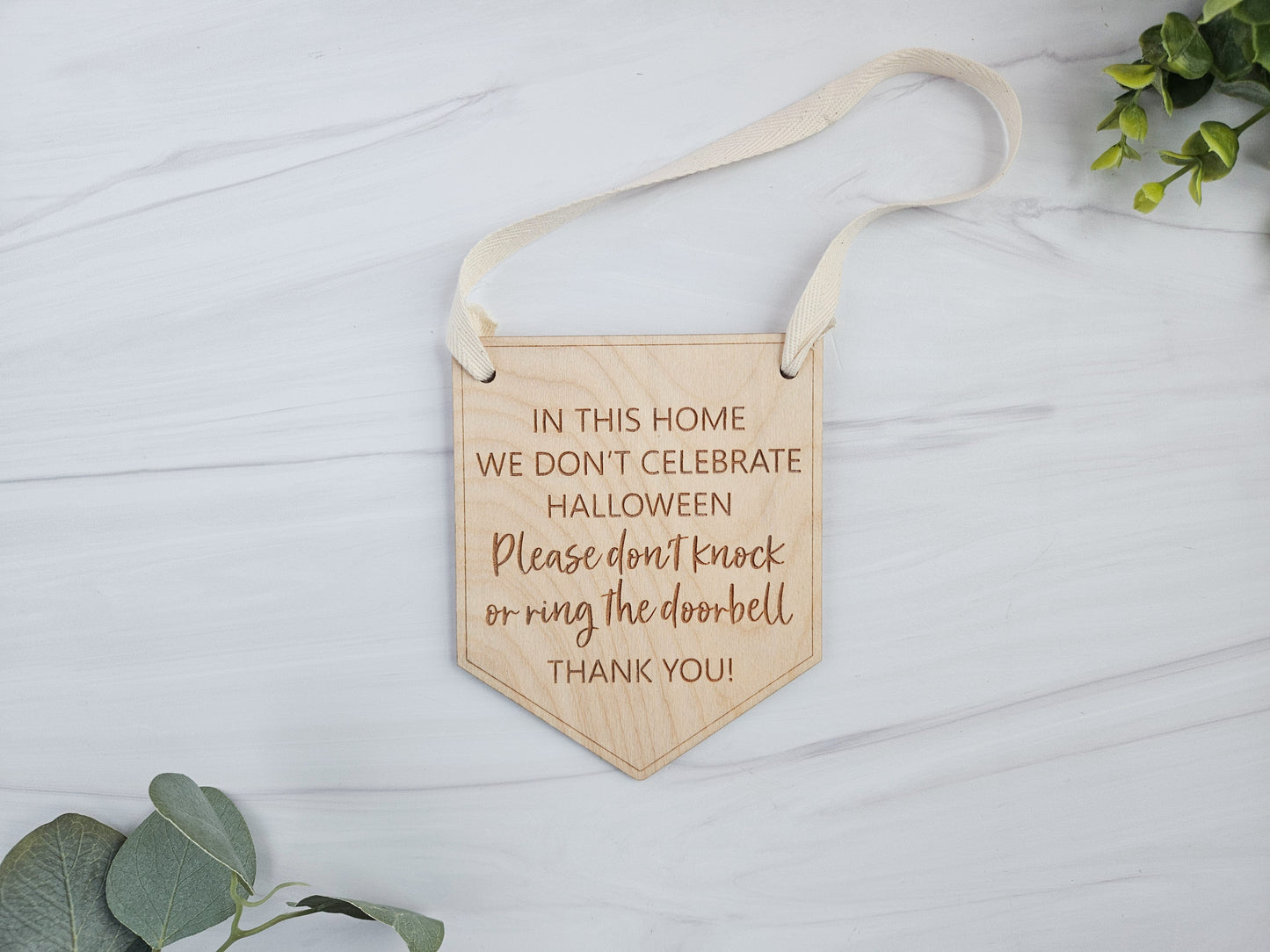 Engraved Wood Door Sign - In This House We Don't Celebrate Halloween