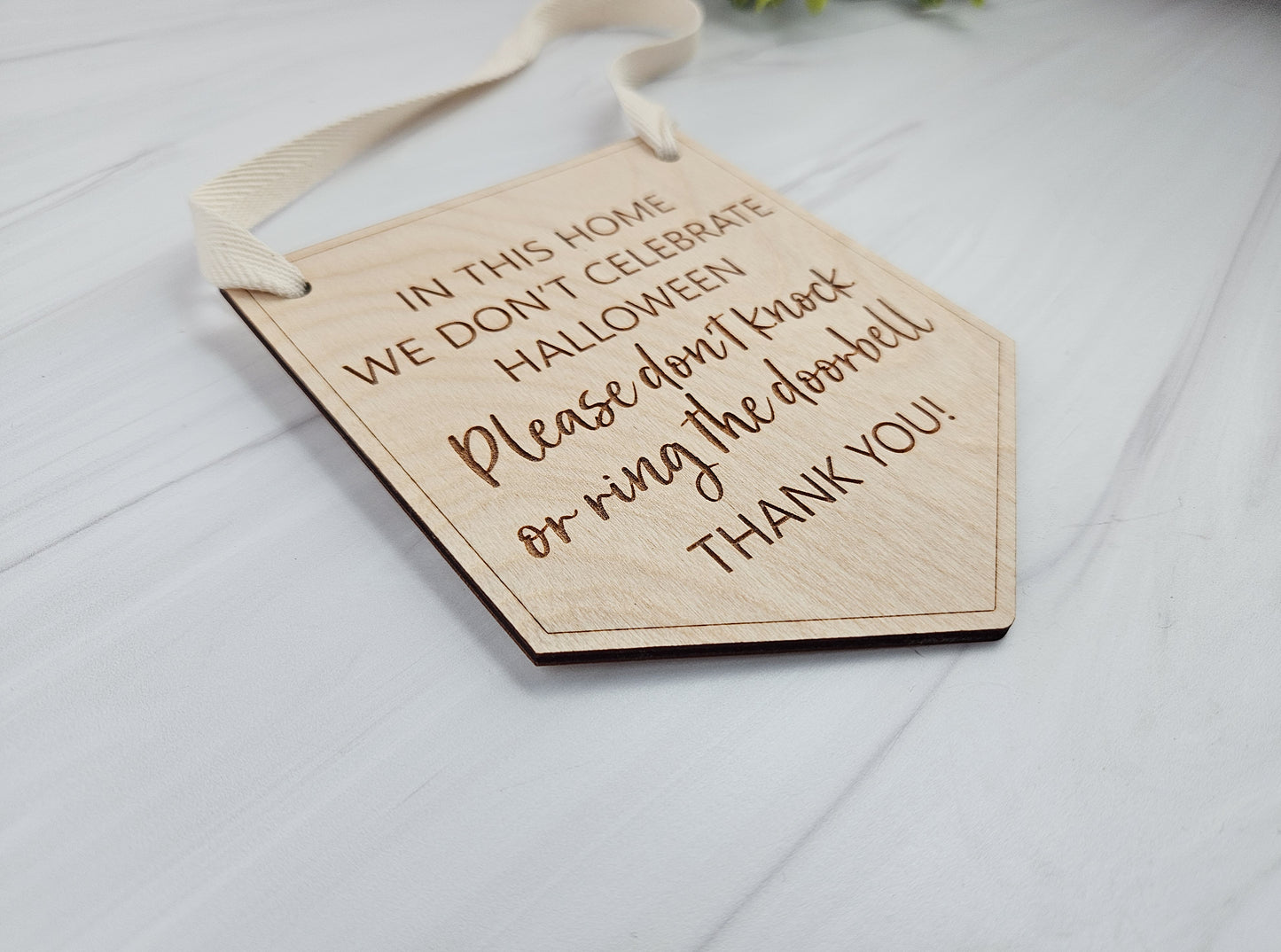 Engraved Wood Door Sign - In This House We Don't Celebrate Halloween